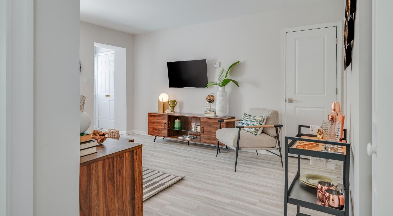 Wide open living areas perfect for entertaining a living room with a tv and furniture
