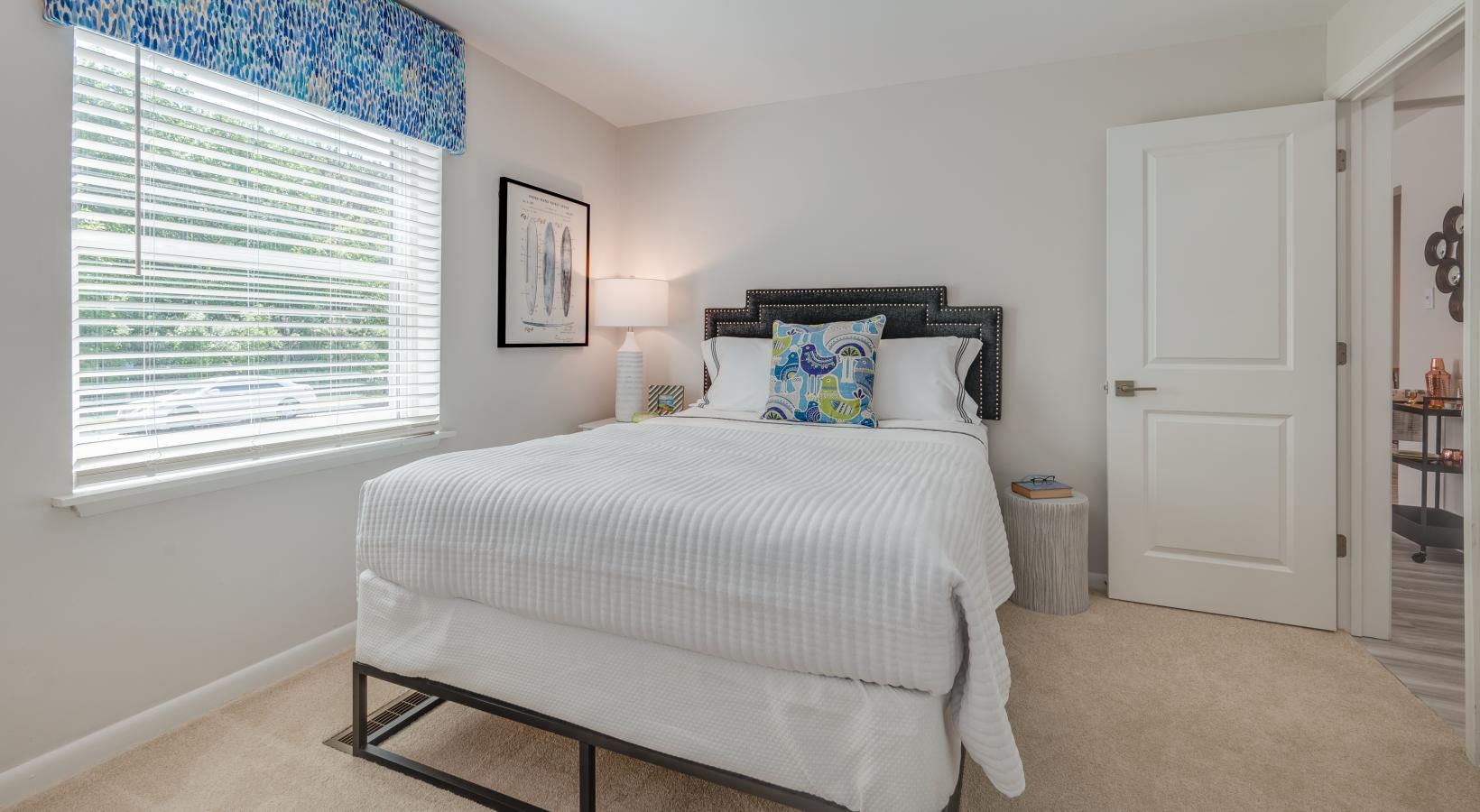 Generous bedroom offerings to fit every family carpeted bedroom with a large window