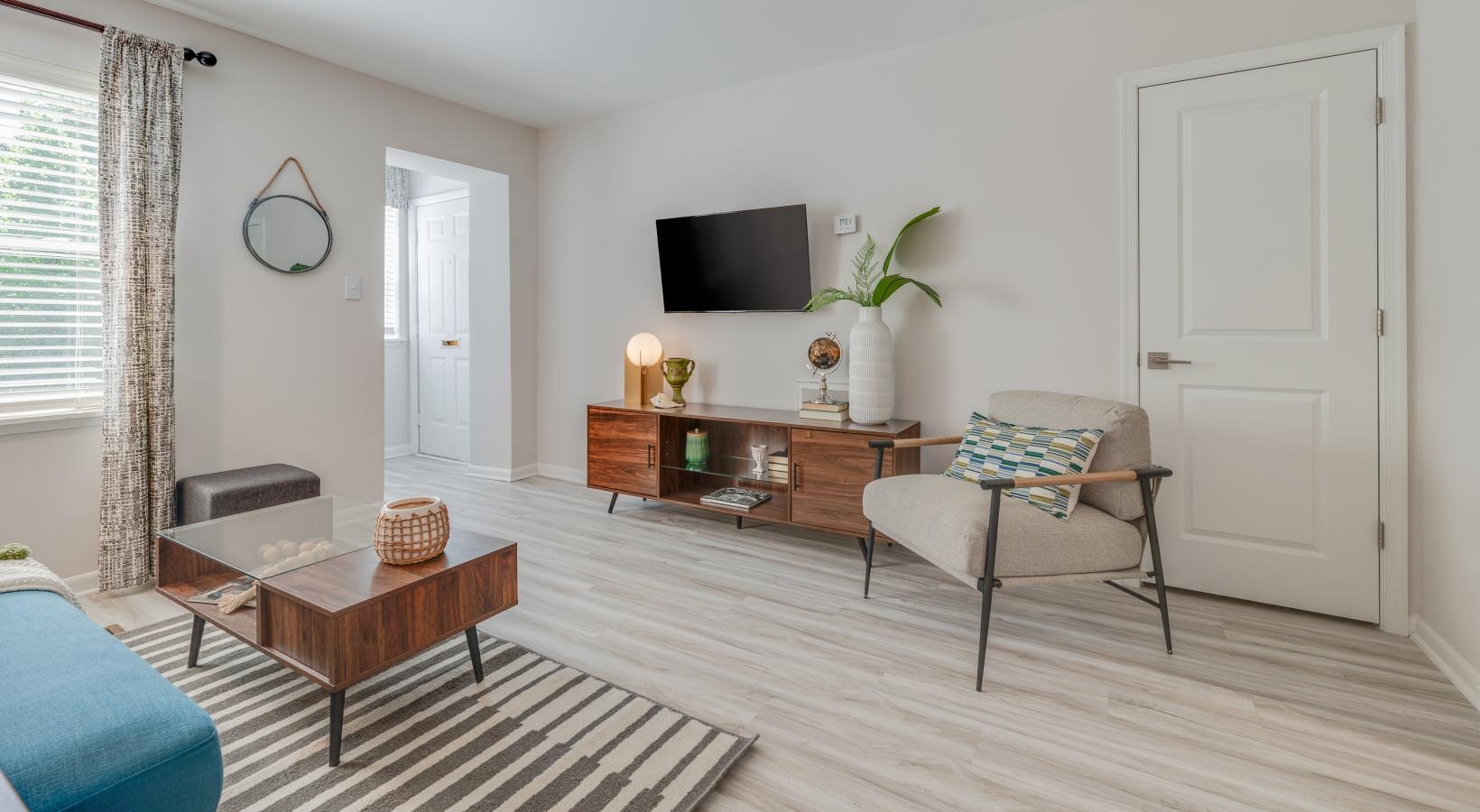Wide open living areas flooded with natural light large window in bright living room