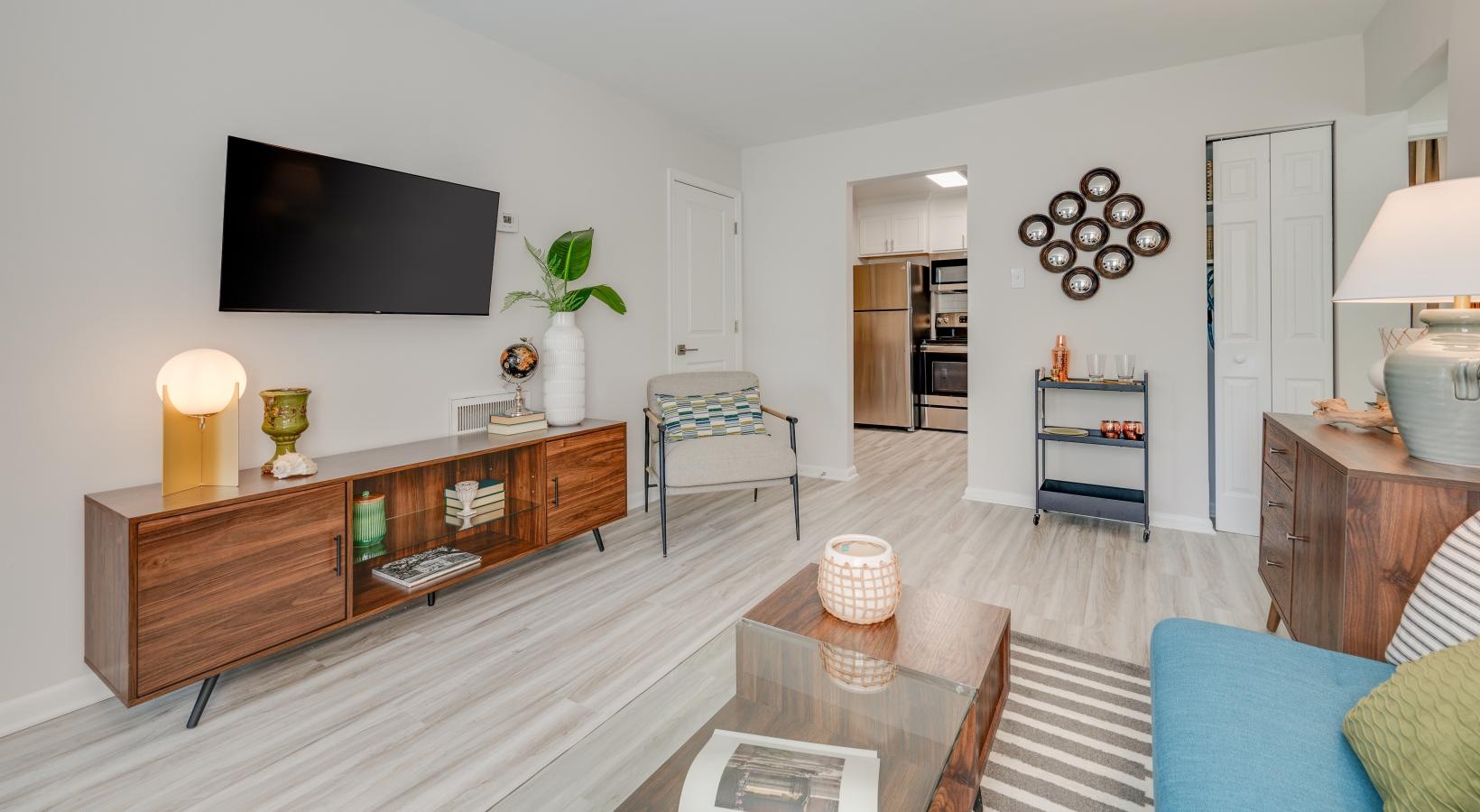 Generous living spaces to relax and unwind spacious living room with storage closet