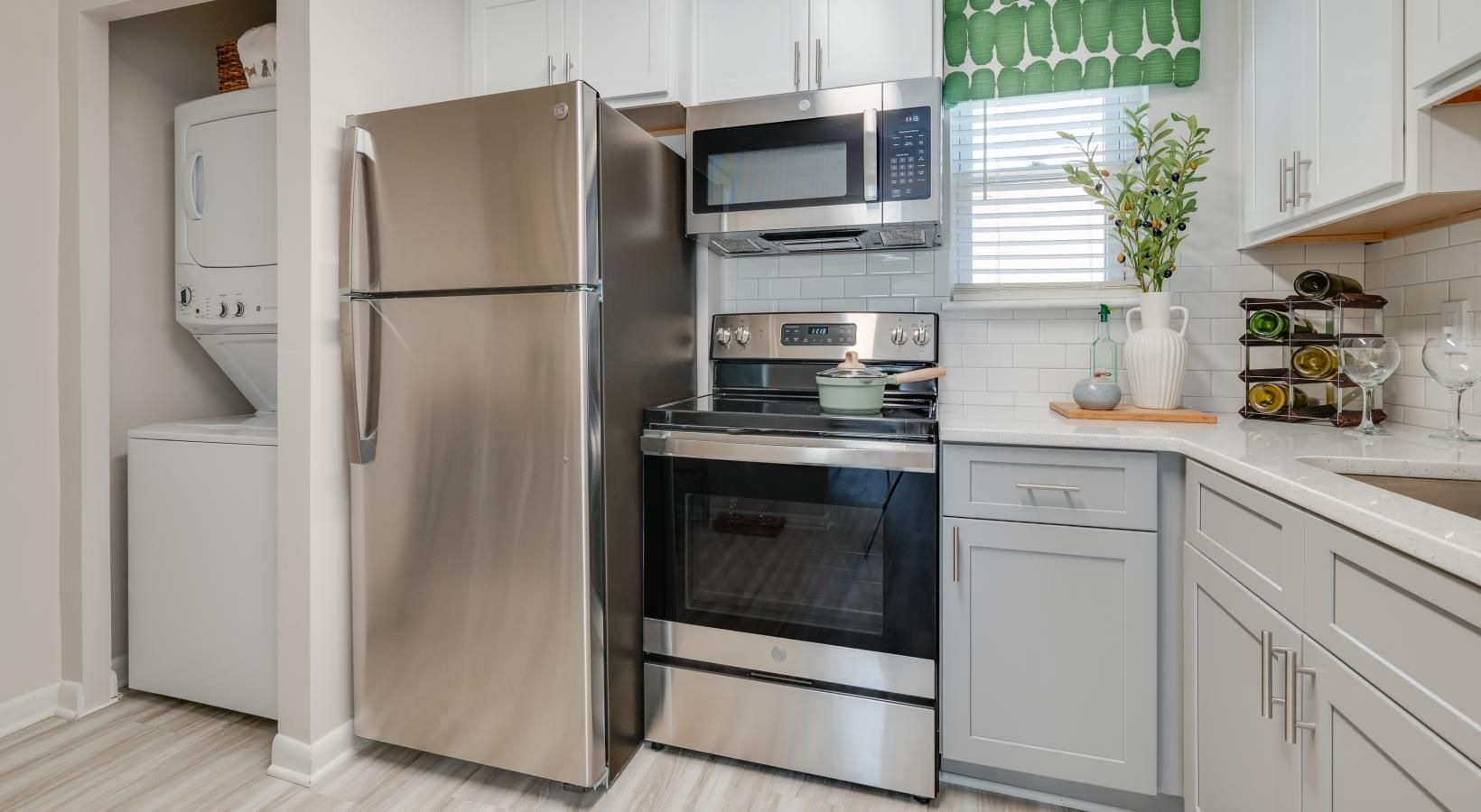 Laundry has never been easier laundry closet in bright kitchen