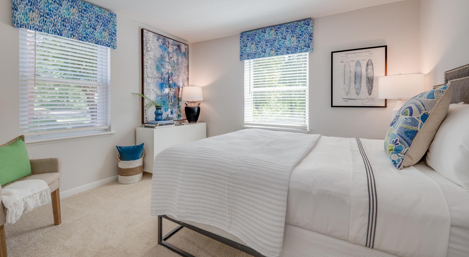 Sleep in style spacious bedroom with bright windows